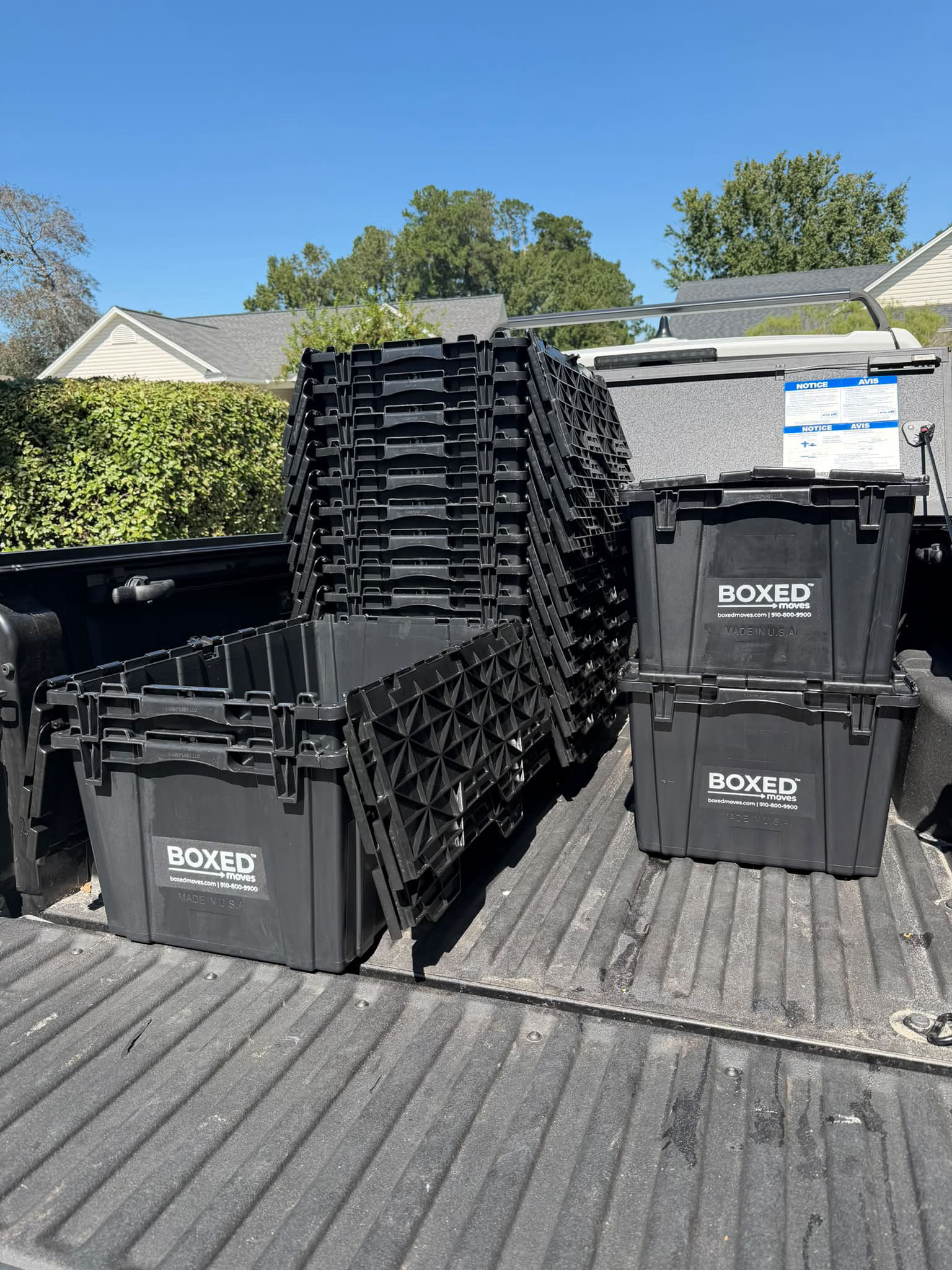 Boxed Moves LLC stacked reusable moving totes ready for delivery in Wilmington, NC